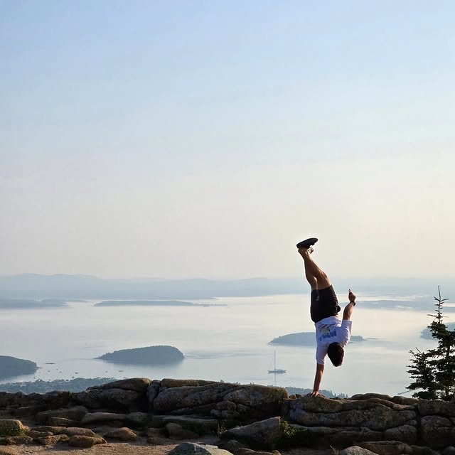 Me doing a handstand on a rock in Acadia National Park