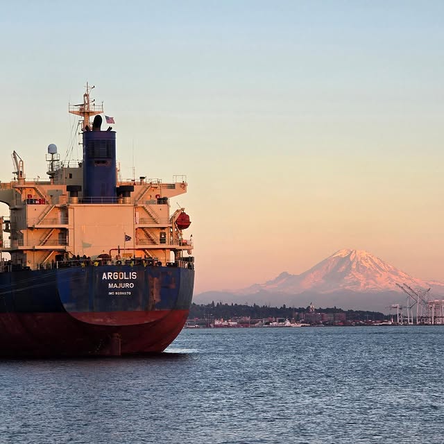 A boat observes the sunset on Mt. Washington