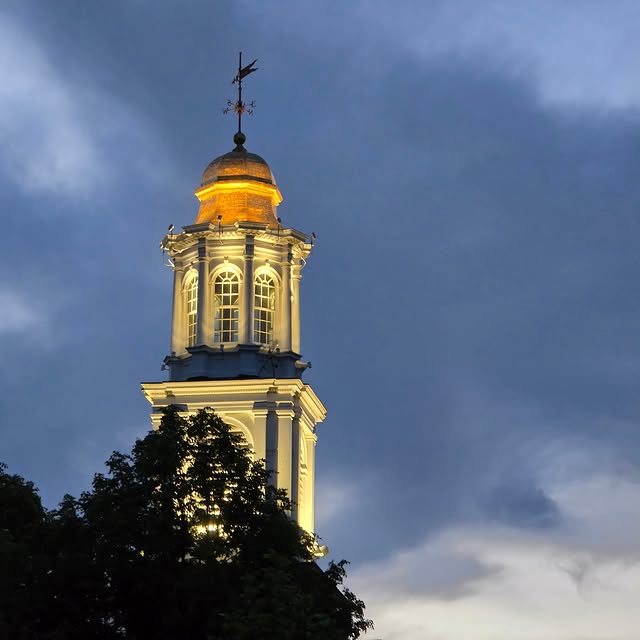 The Colgate University Chapel lit up at dusk